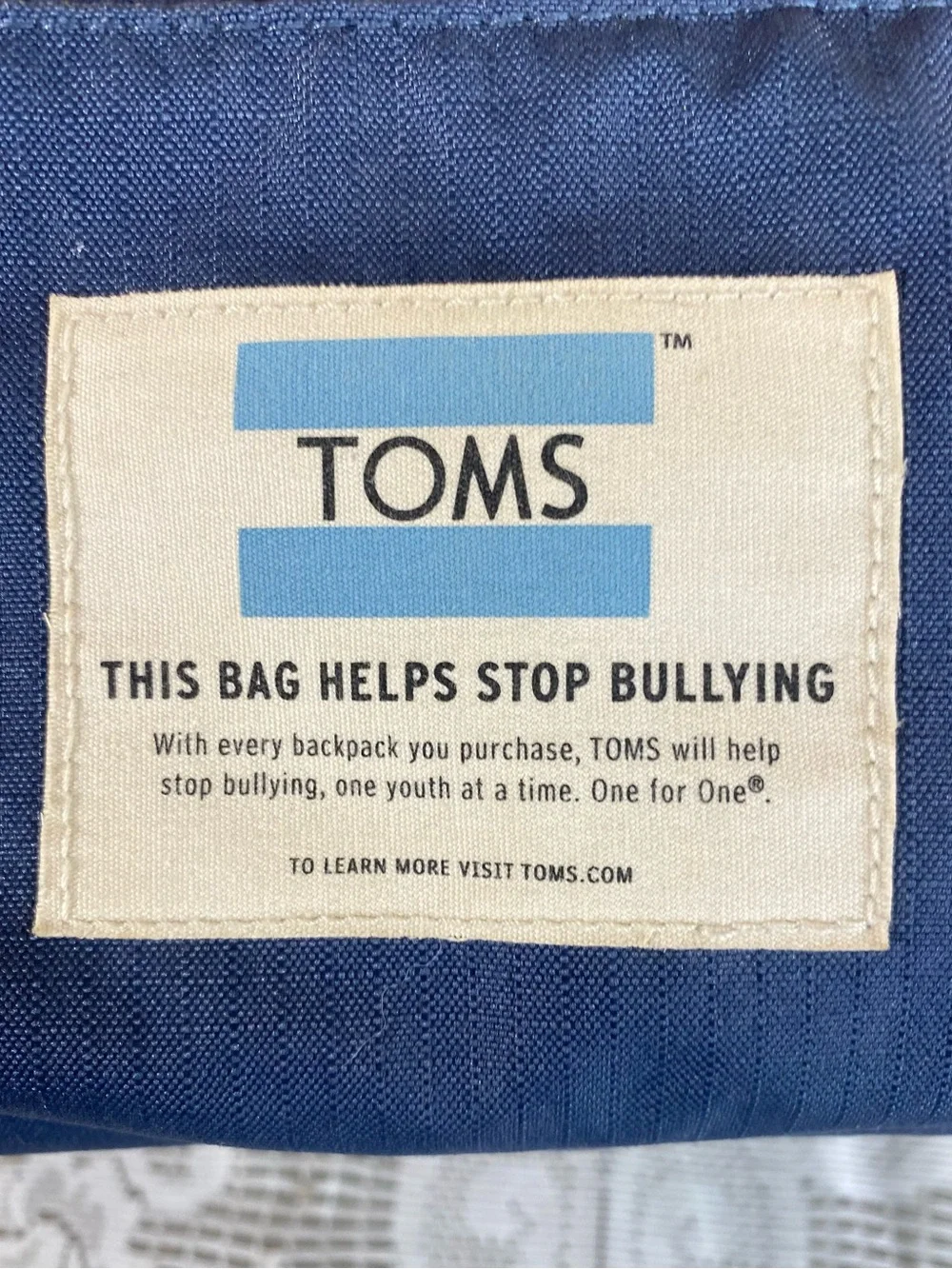 TOMS Stand Up To Bullying Backpack Navy w Patterned Trim Durable Water Resistant